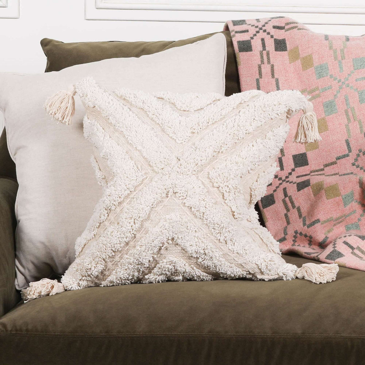 Boho Natural Cushion Cover 45cm displayed on a sofa, featuring textured design and tassels, dimensions H45 x W45 cm.