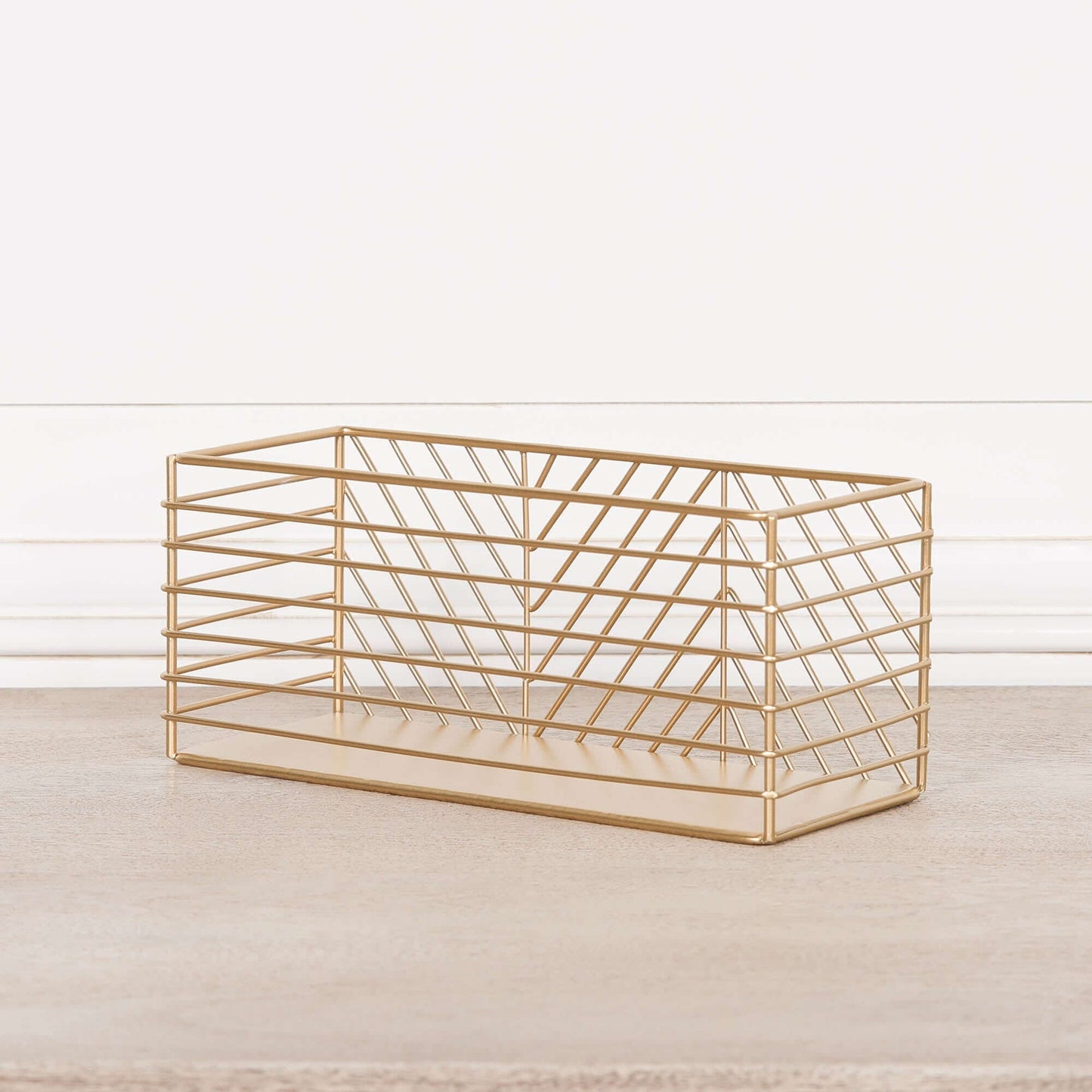 Gold metal storage basket for organizing stationery, makeup brushes, or bathroom essentials with a chic design.
