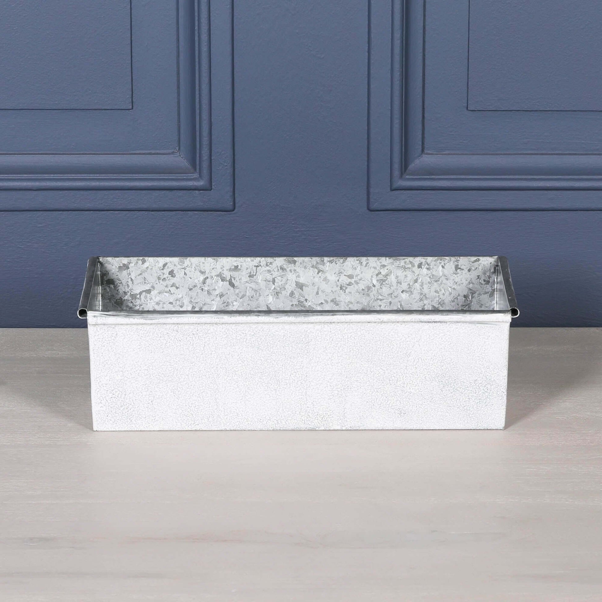 White Wash Metal Window Box Planter Roll Top - 44cm with a rustic design on a wooden surface.