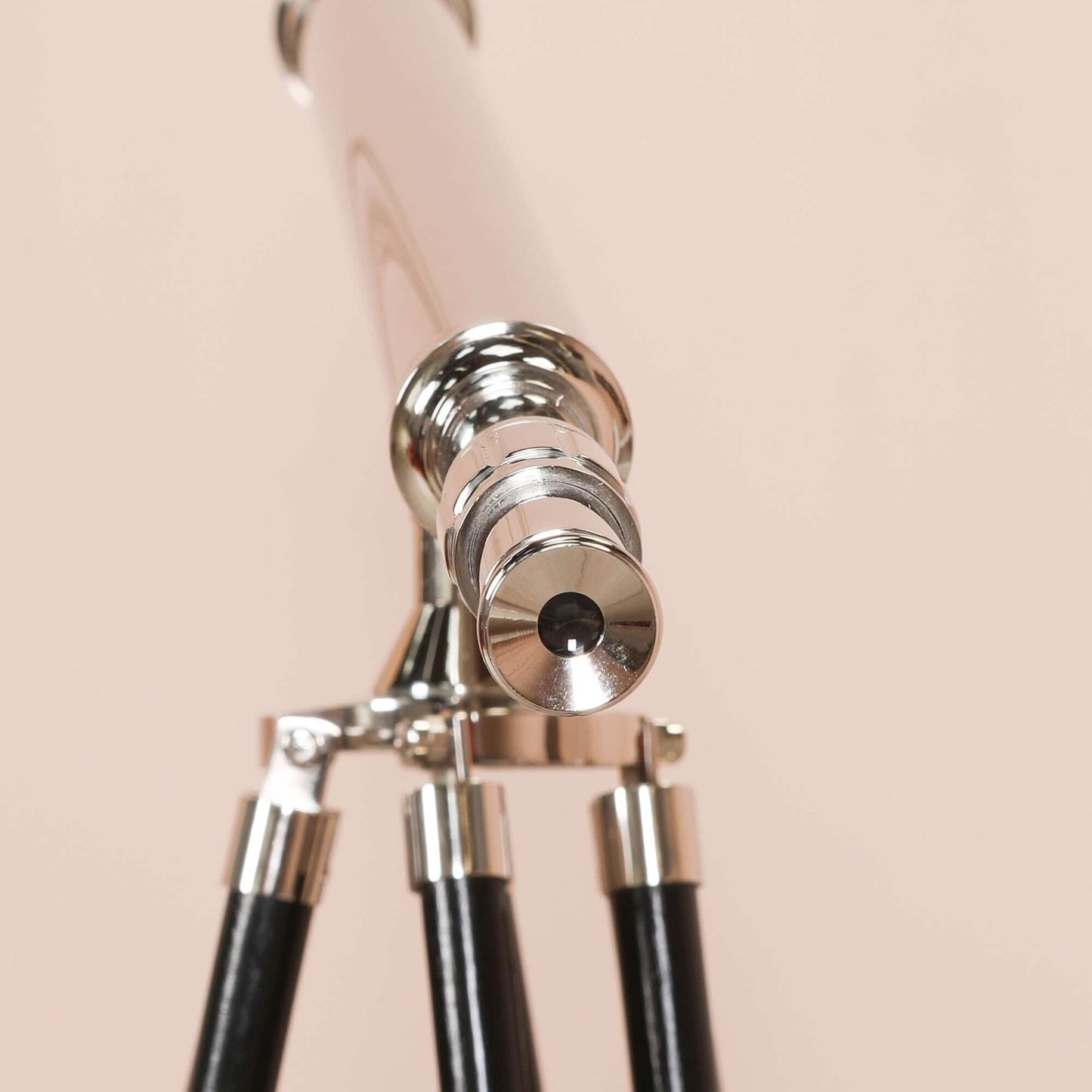 Nickel Telescope on Black Wooden Stand