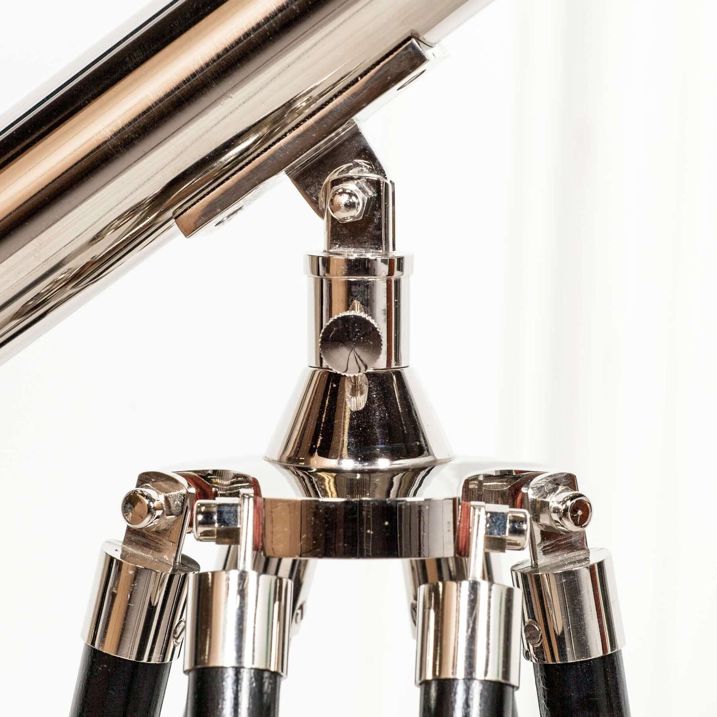 Nickel Tripod Telescope on Black Wooden Stand