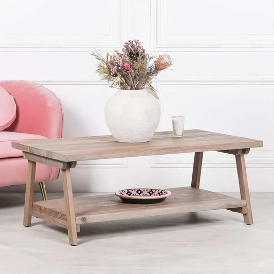 rustic coffee table with vase and flowers on top