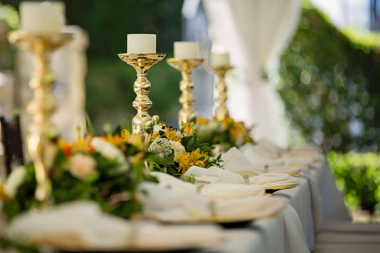 Elegant wedding table decor featuring gold candle holders and floral arrangements for Wedding Decor Trends.