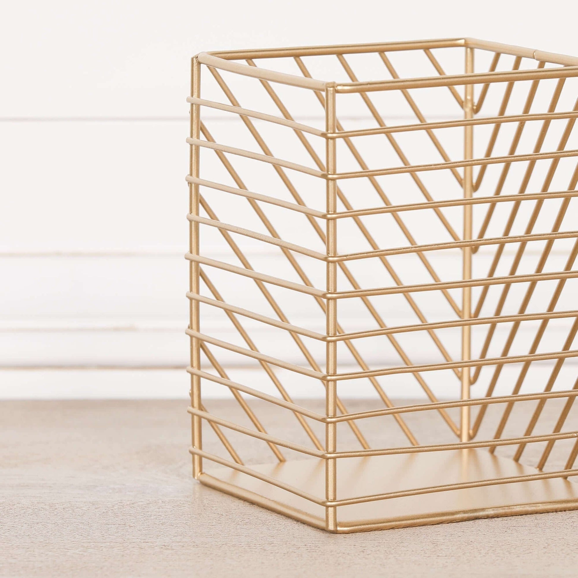 Gold Painted Square Metal Storage Basket with a geometric design, perfect for stylish organization.