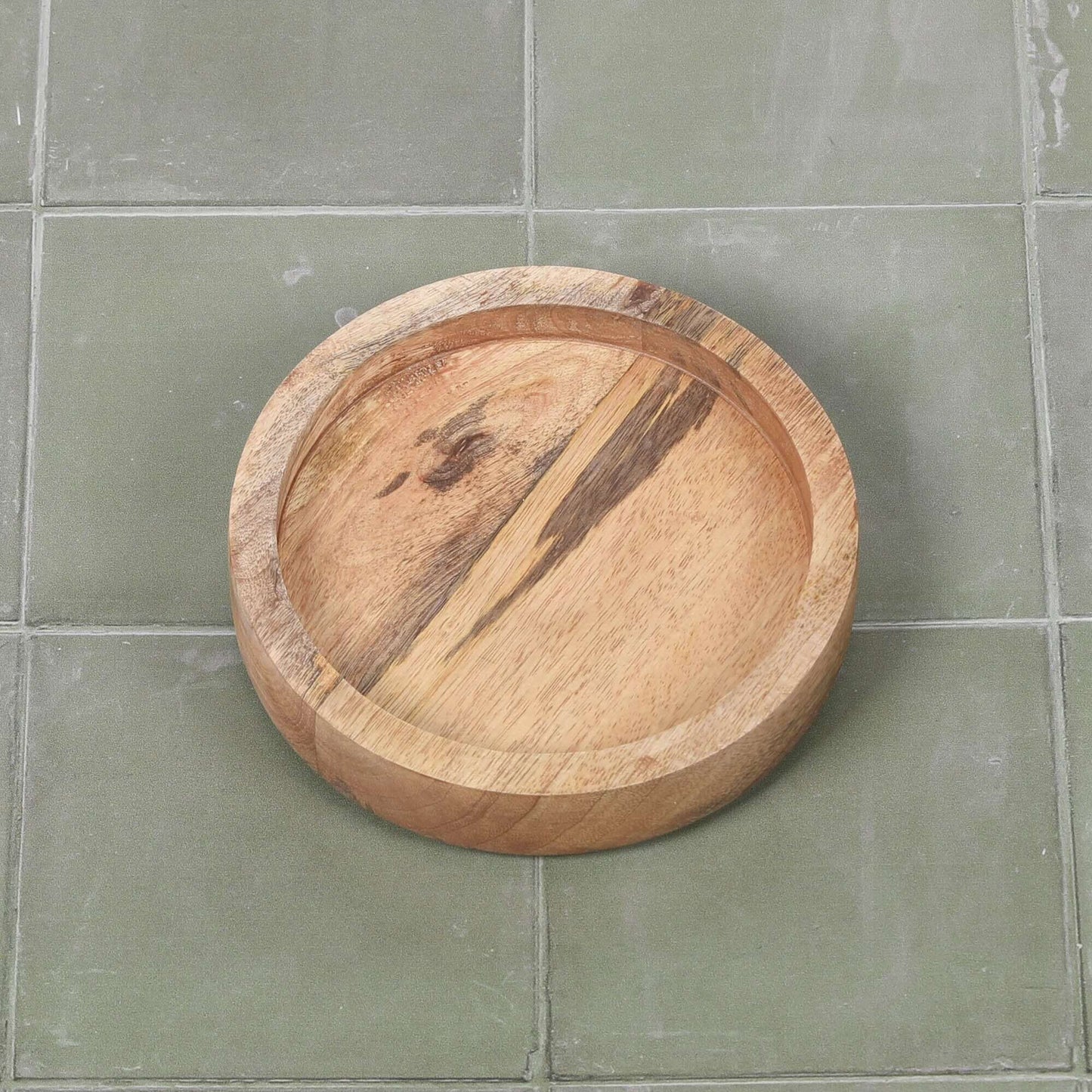 Round 15cm Wooden Tray made of mango wood, featuring a smooth surface and natural wood grain.