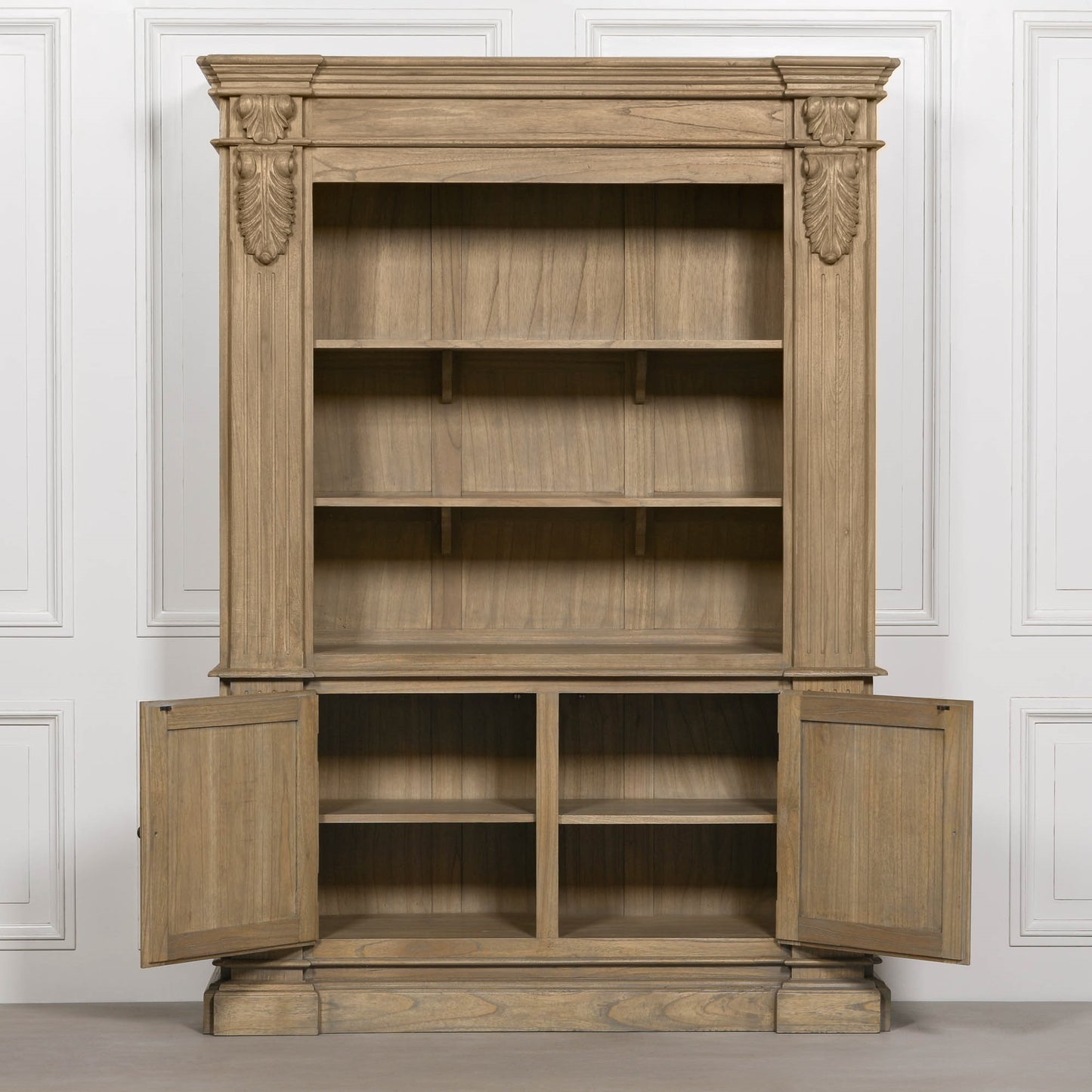 Large White Cedar Open Bookcase with Hand-Carved Corbel Details showcasing spacious shelving and lower cupboards.