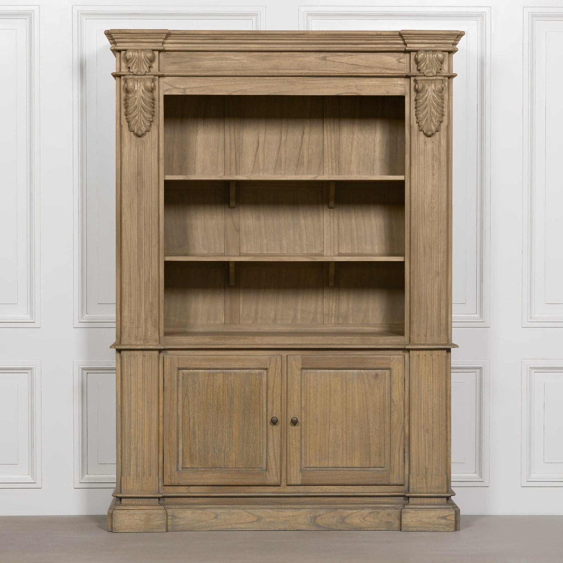 Large White Cedar Open Bookcase with Hand-Carved Corbel Details showcasing open shelves and lower cupboards.