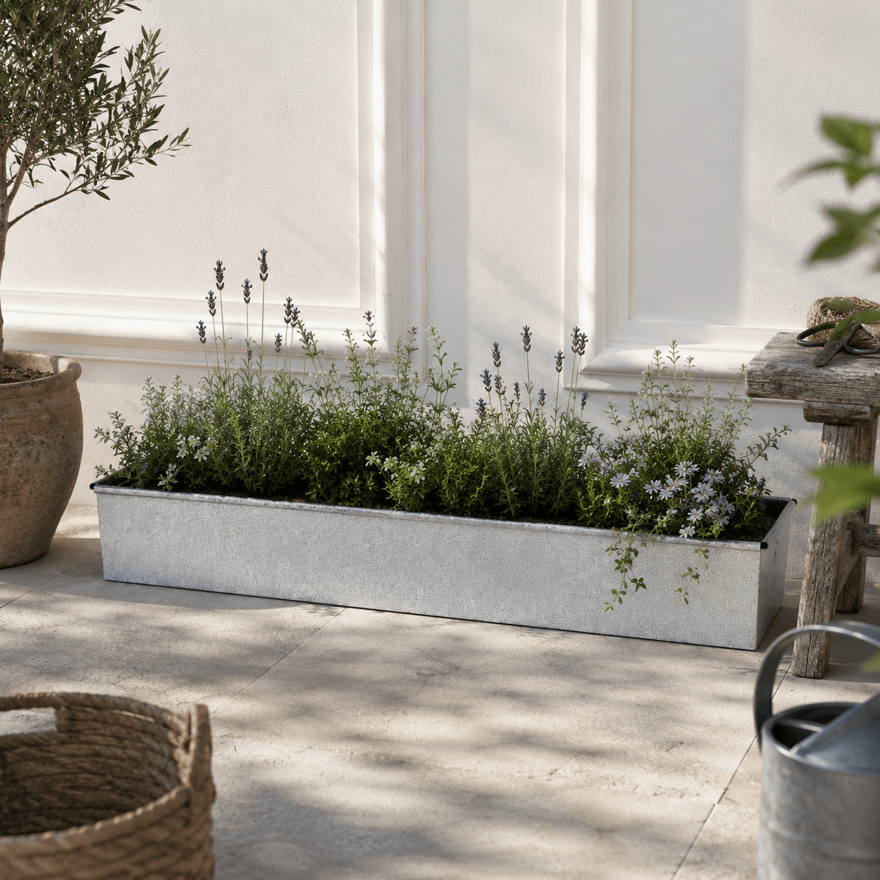 Garden planter trough bed with plants on a patio